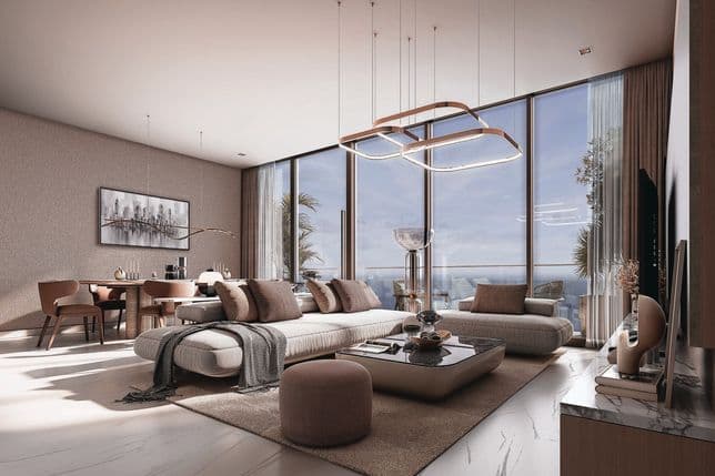 Modern living room with large windows, cozy sofas, a coffee table, and chic decor. Sunlight floods the luxurious space, offering ocean views.
