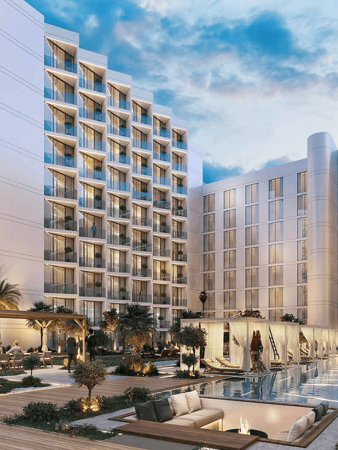 Gym at Playa Viva with modern equipment and large windows facing landscaped outdoor areas on Al Marjan Island.