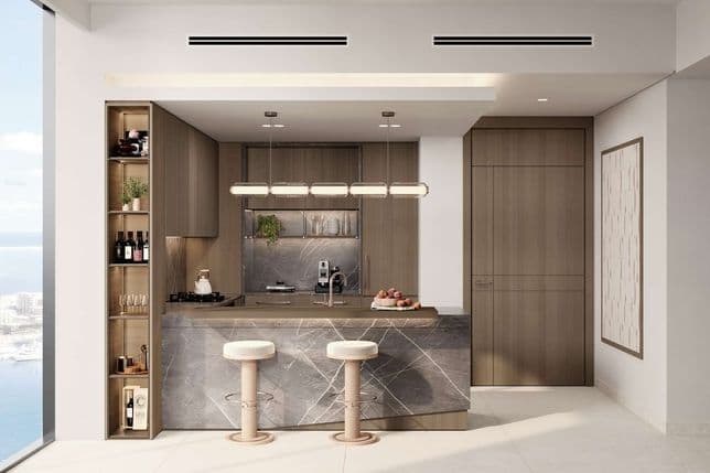 Modern kitchen with marble island, bar stools, pendant lighting, and floor-to-ceiling window offering a city and water view.