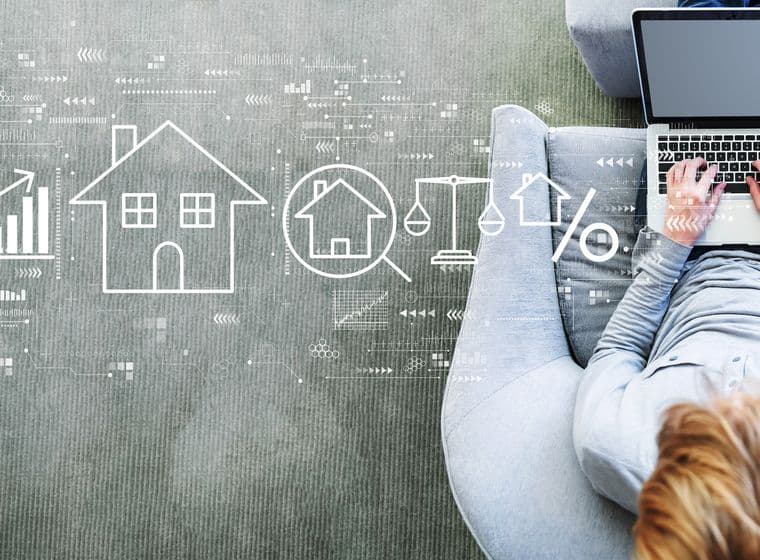 Woman sitting in a modern gray chair with laptop, surrounded by digital icons like house and bar chart – digital work in real estate industry