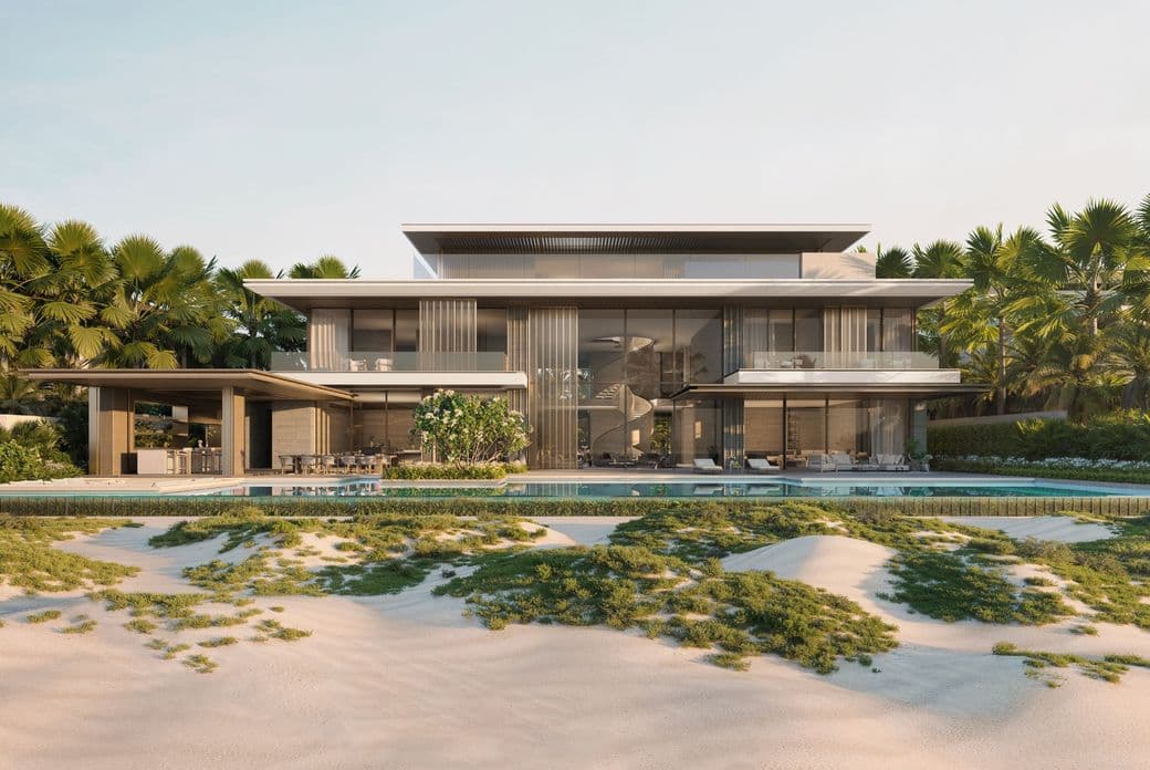 Modern beachfront villa with large glass windows, surrounded by palm trees, featuring an outdoor pool and sandy landscape in the foreground.