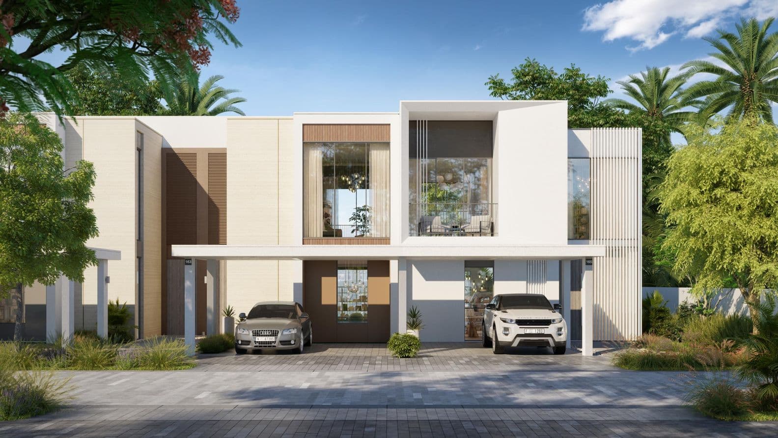 Modern two-story house with large windows, a flat roof, and two cars parked in the driveway, surrounded by lush greenery under a clear blue sky.