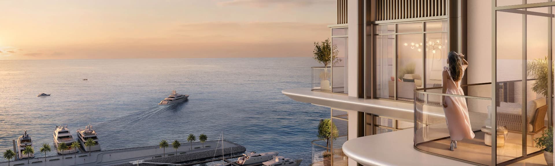 A modern balcony overlooking the ocean at sunset, with yachts in the water and a person relaxing in a glass-walled section.