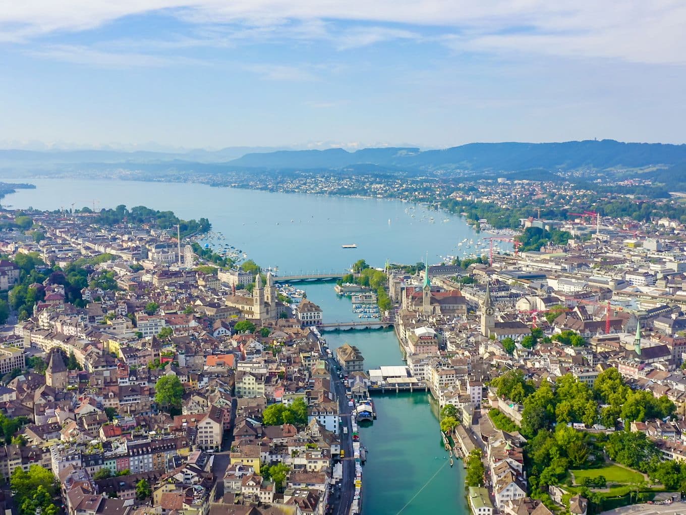 Aerial view of Zurich’s Old Town with Lake Zurich and the Alps – Engel & Völkers Real Estate Zurich