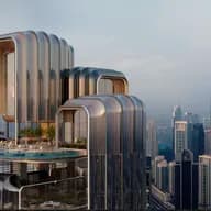 Futuristic skyscraper with curved architecture, rooftop pool, and greenery, set against a city skyline featuring a tall, iconic tower.