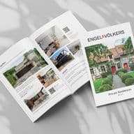 Open magazine spread with luxury real estate listings, featuring images and descriptions of modern homes. Cover title: "Engel & Völkers Private Residences."