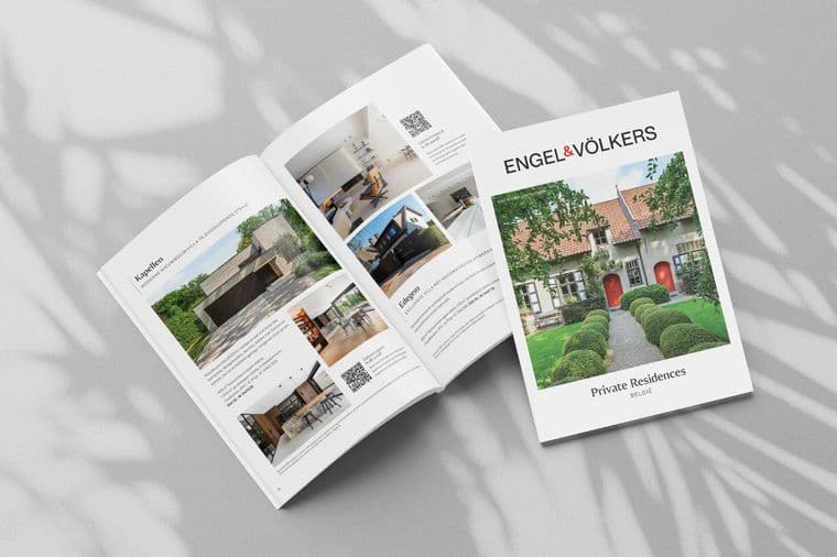 Open magazine spread with luxury real estate listings, featuring images and descriptions of modern homes. Cover title: "Engel & Völkers Private Residences."