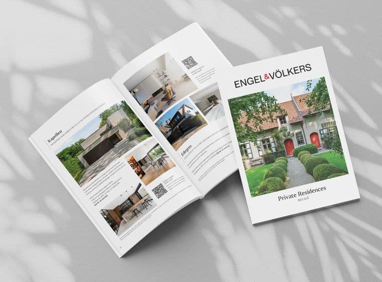 Open magazine spread with luxury real estate listings, featuring images and descriptions of modern homes. Cover title: "Engel & Völkers Private Residences."