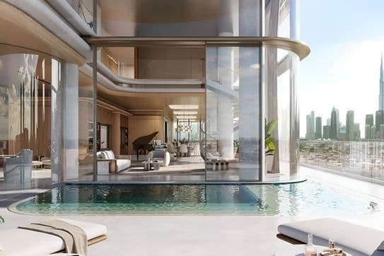 Luxurious modern penthouse with a glass-walled pool, elegant interior, and city skyline view through large windows.
