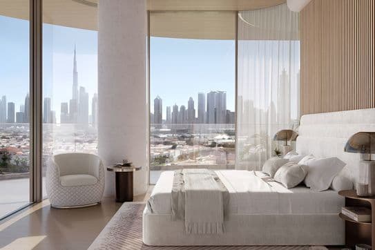Modern bedroom with a large window view of a city skyline, featuring a plush bed, elegant chair, and sleek decor in neutral tones.