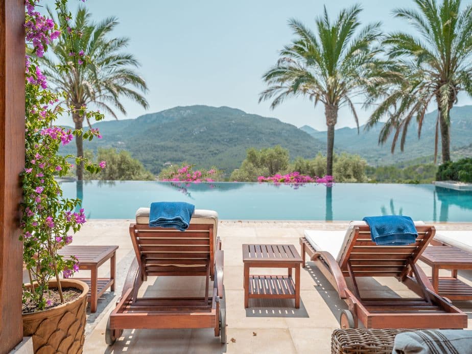 Mountain views from terrace with flowers and infinity pool in Son Vida.
