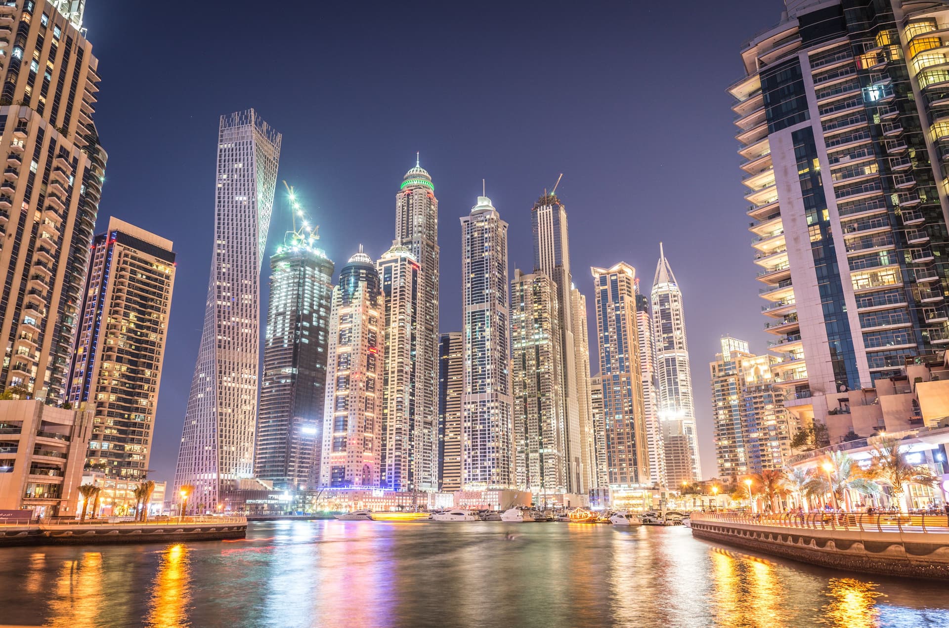 Marina Skyline at night time from the bridge with reflections on the water