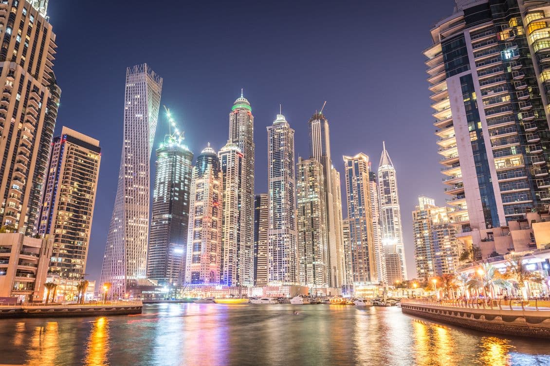 Marina Skyline at night time from the bridge with reflections on the water