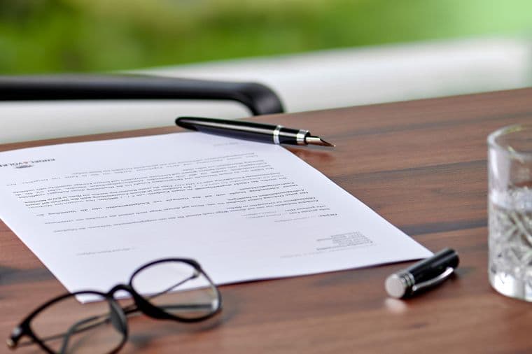 Pen lies on document for signature