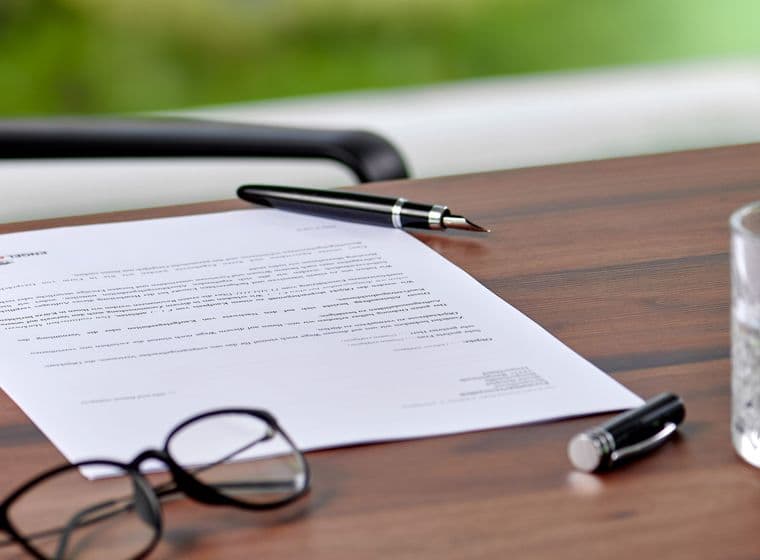 Pen lies on document for signature