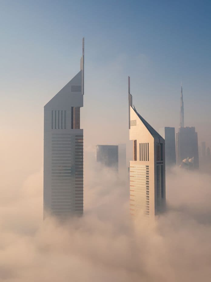 emirates financial towers in clouds aerial view