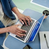 man registers the Ejari for his Dubai rental property using his laptop