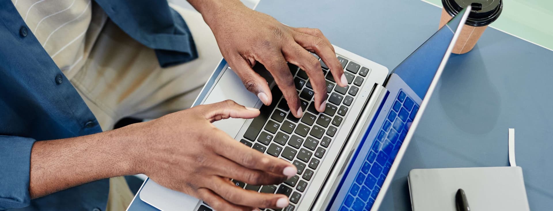 man registers the Ejari for his Dubai rental property using his laptop