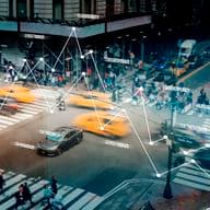 Busy city street scene with blurred motion, featuring yellow taxis, pedestrians, and overlaid data graph.