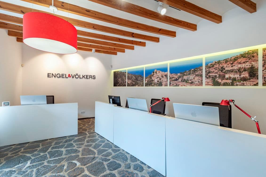 Sunlit interior of Engel & Völkers office in Deià