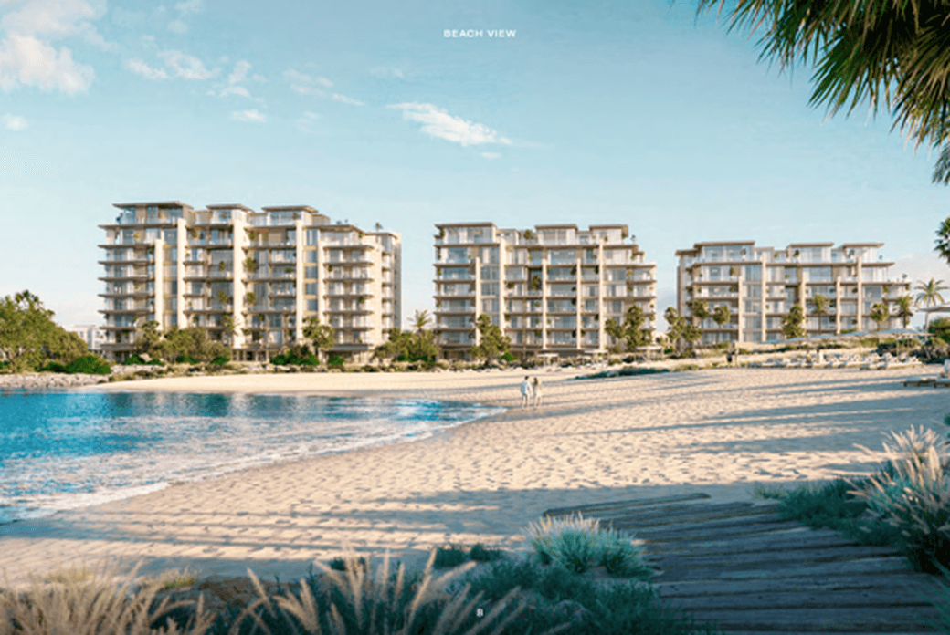 Landscaped coastal community at Solaya on La Mer with shaded paths and green spaces.