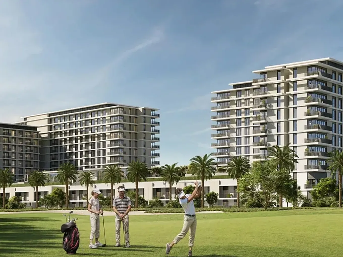 Three people playing golf on a lush green course with tall modern buildings and palm trees in the background under a clear blue sky.