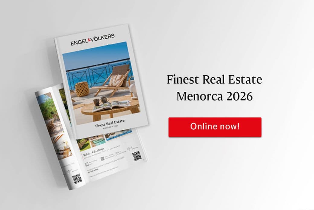 Open catalogue layout of “Finest Real Estate Menorca 2026” featuring residential properties and coastal scenes on Menorca