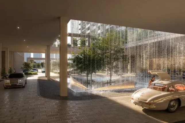 Luxurious carport with a water feature, featuring classic cars and greenery, under modern architecture with soft lighting.