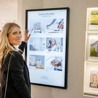 Female Agent infront of display