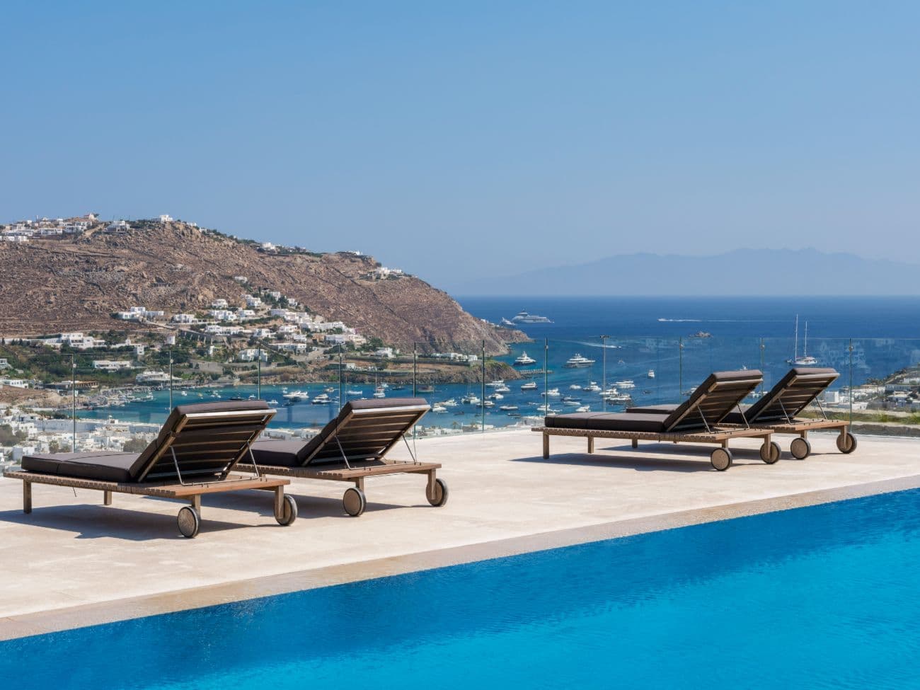 Contemporary ultra-luxury estate in Mykonos with helipad, dual pools & panoramic Aegean views