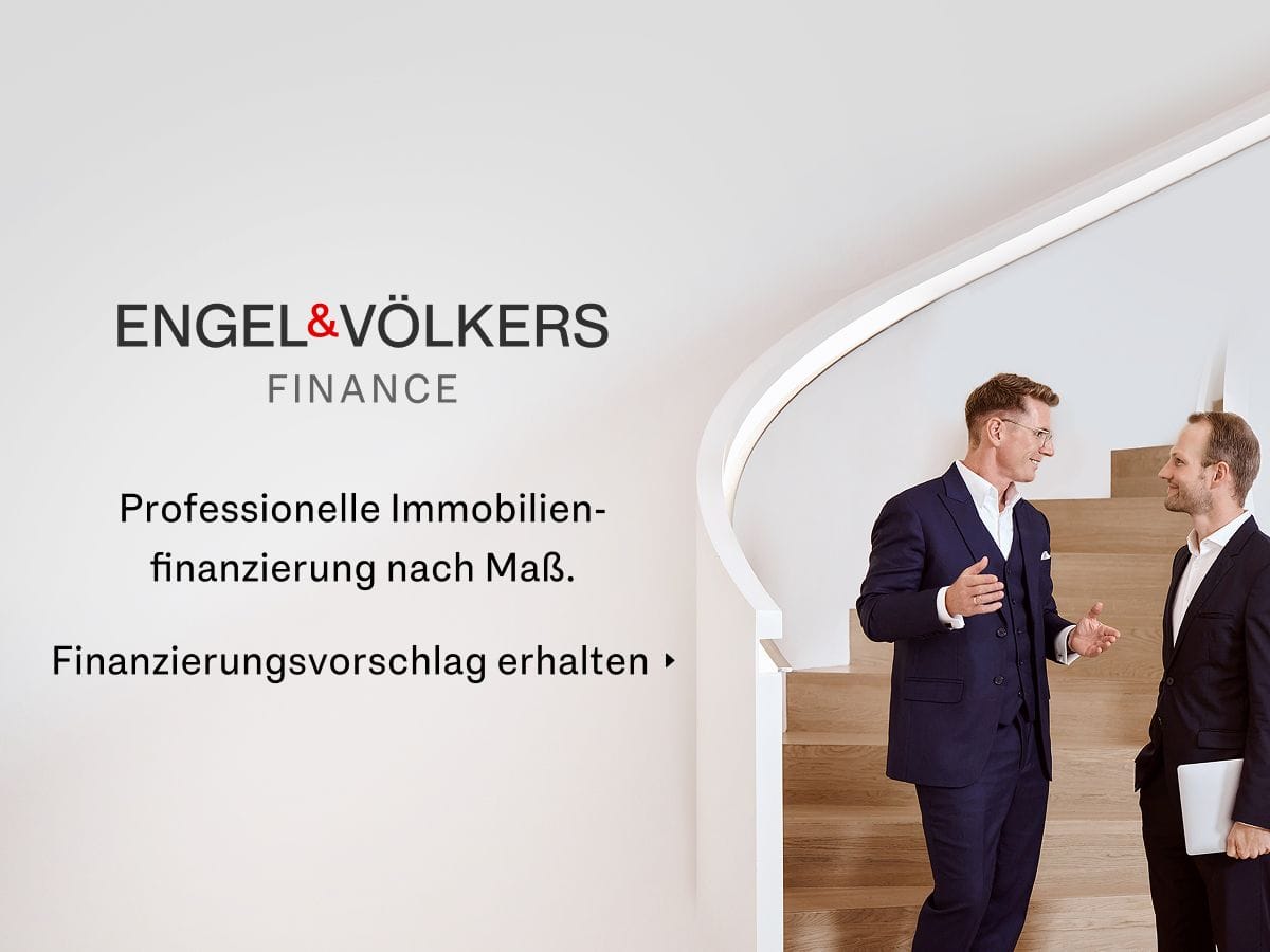 Two men in suits converse on a staircase next to the Engel & Völkers Finance logo. German text about professional real estate financing is displayed.