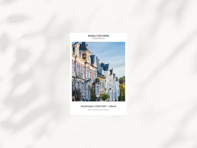 A small brochure cover with a photo of a sunny street lined by colorful European townhouses and Engel & Völkers branding.
