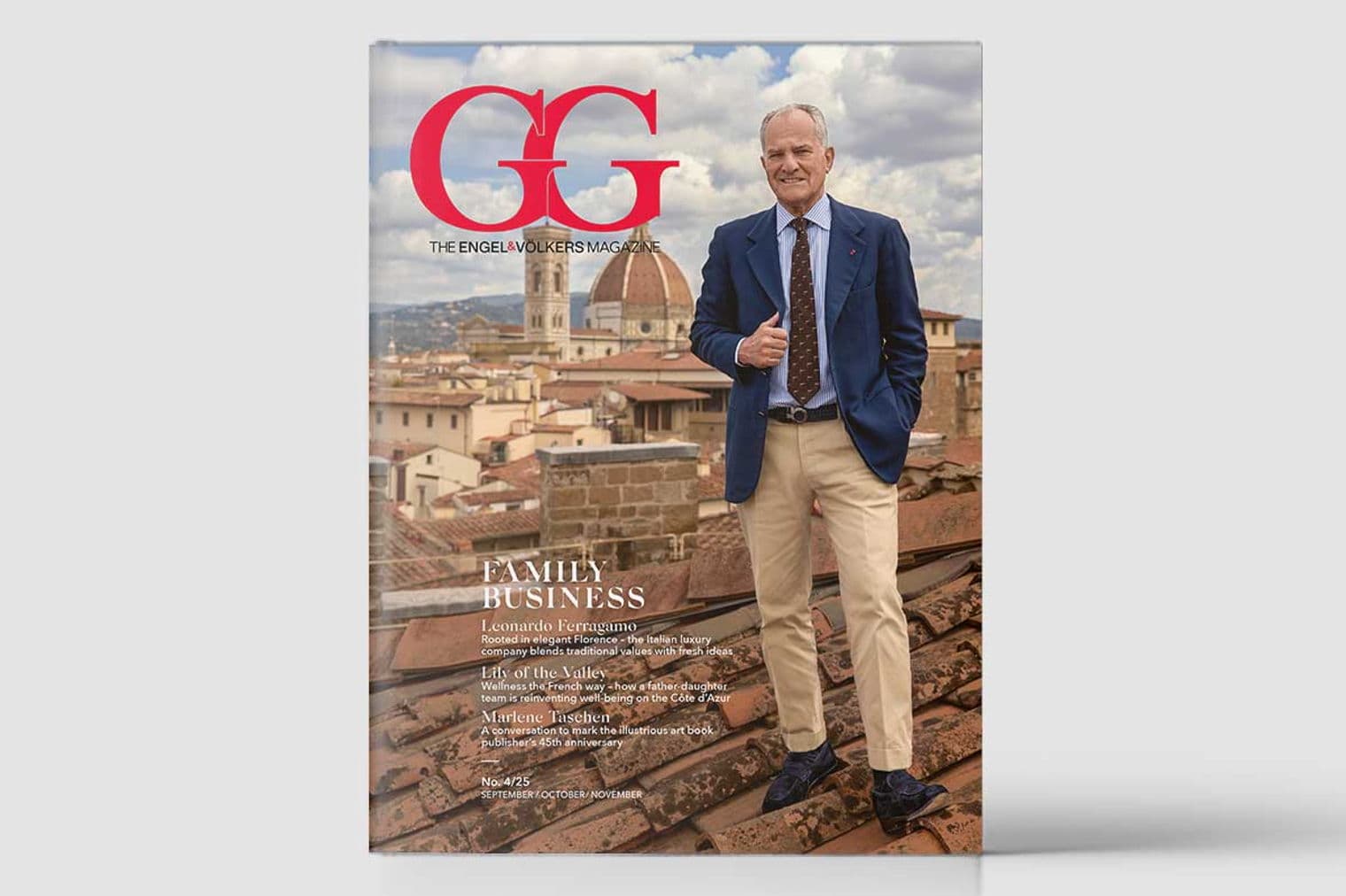 Zeitschriftencover mit einem Mann in einem blauen Blazer und beigen Hosen, der auf einem Dach mit Florenz im Hintergrund steht.