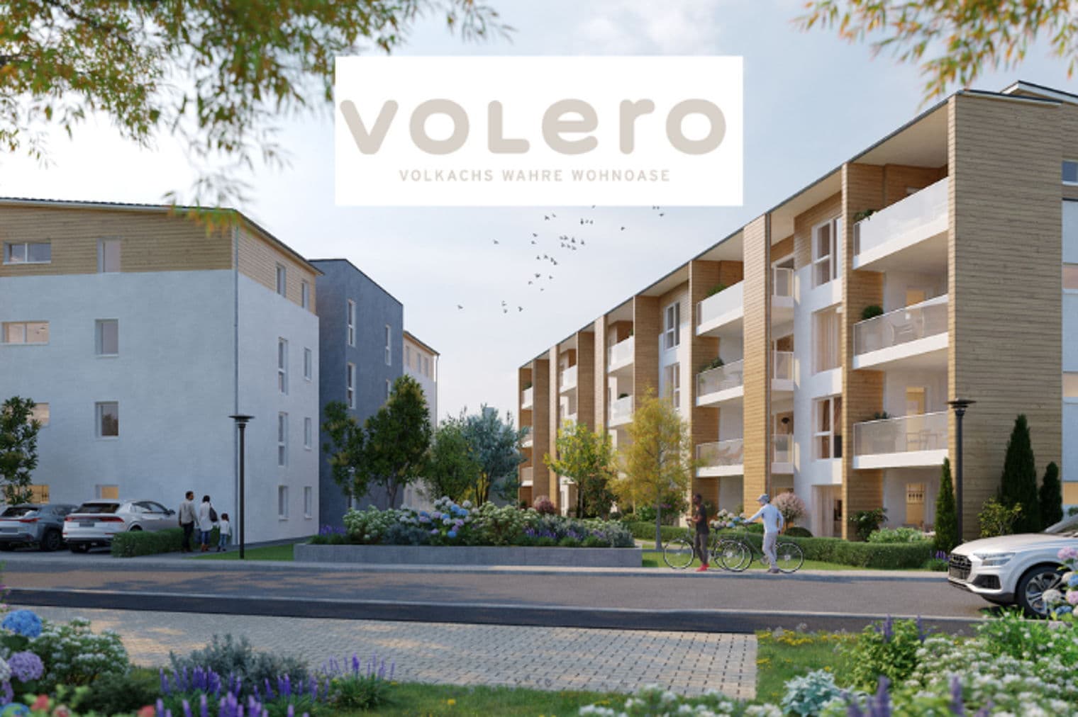Außenansicht moderner Apartments mit Balkonen, Landschaftsgestaltung und Menschen, die spazieren gehen und Fahrrad fahren. "volero"-Logo oben.