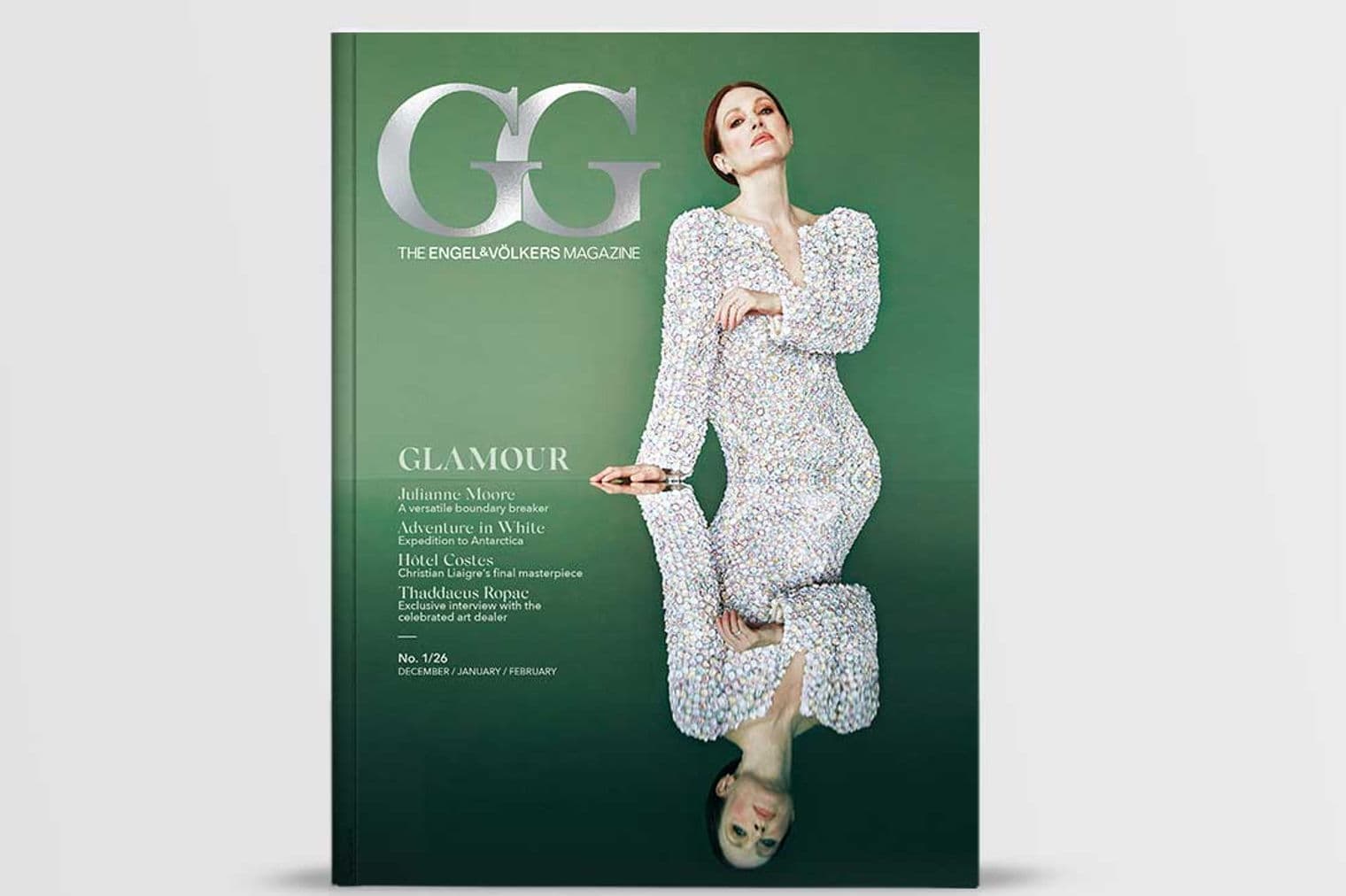 Magazine cover featuring Julianne Moore in a white sequin dress against a green background, reflected below.