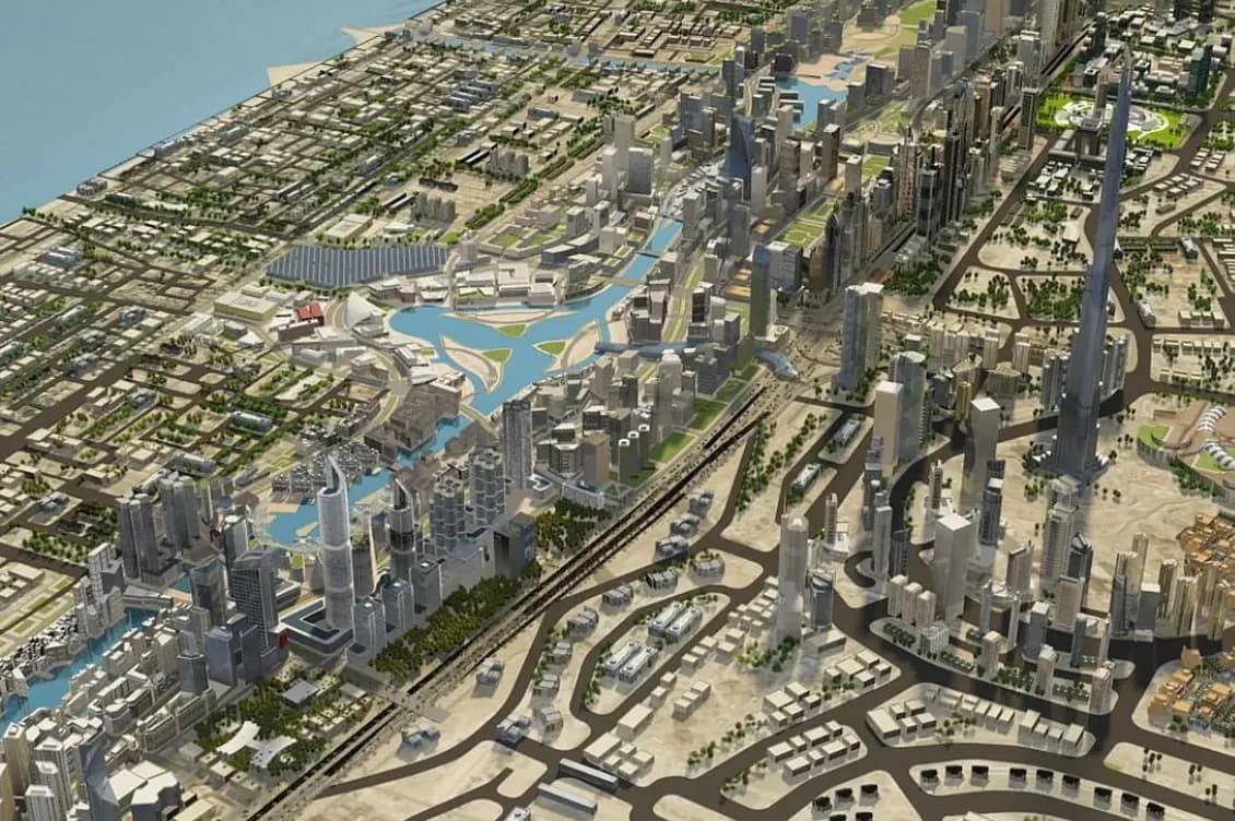 Aerial view of a modern cityscape with numerous skyscrapers, green spaces, waterways, and coastal area in the background.