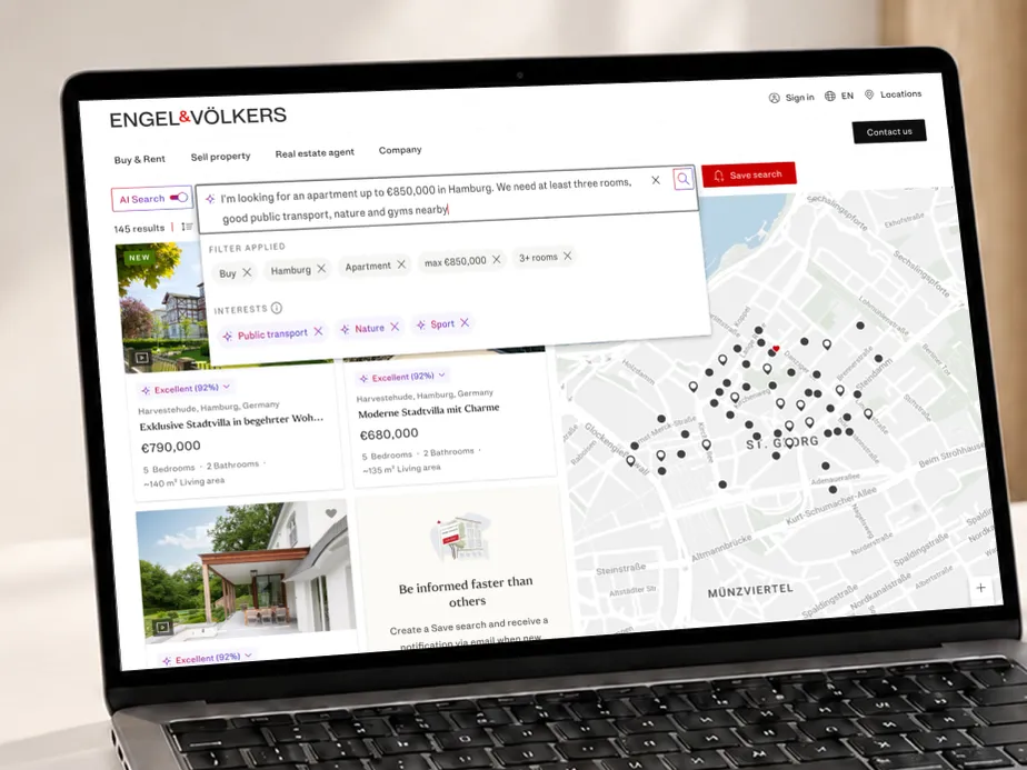 Laptop screen shows Engel & Völkers real estate site with AI Search, a map and property listings in Hamburg. AI-generated image