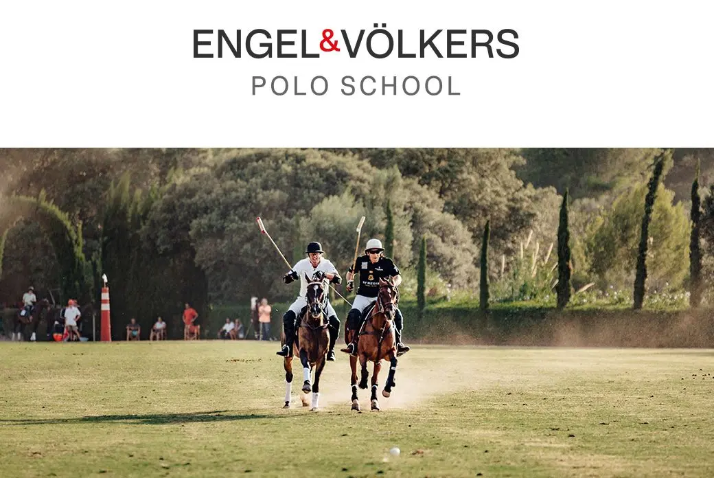 Two polo players on horseback compete on a green field, trees in the background. "Engel & Völkers Polo School" logo at the top.
