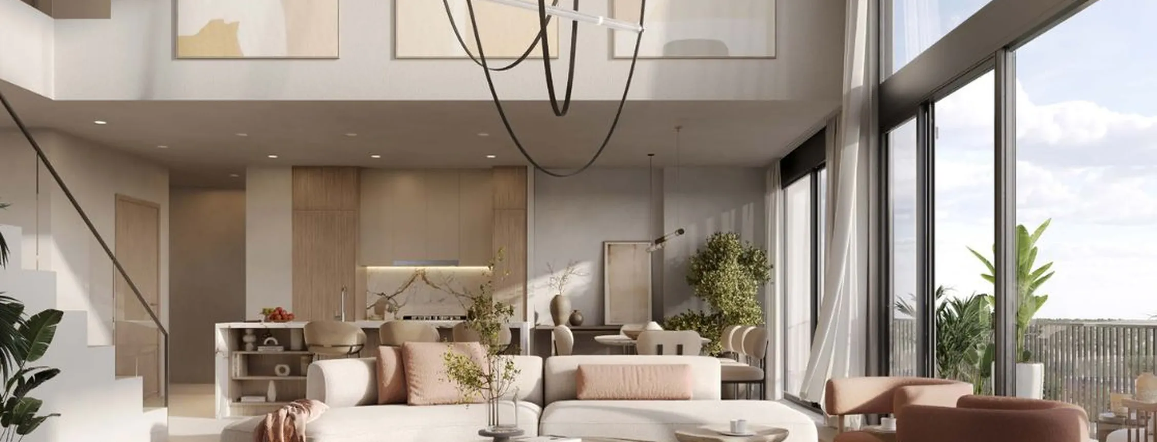 Open-plan living area in duplex at Distrikt featuring double-height ceilings and contemporary lighting.