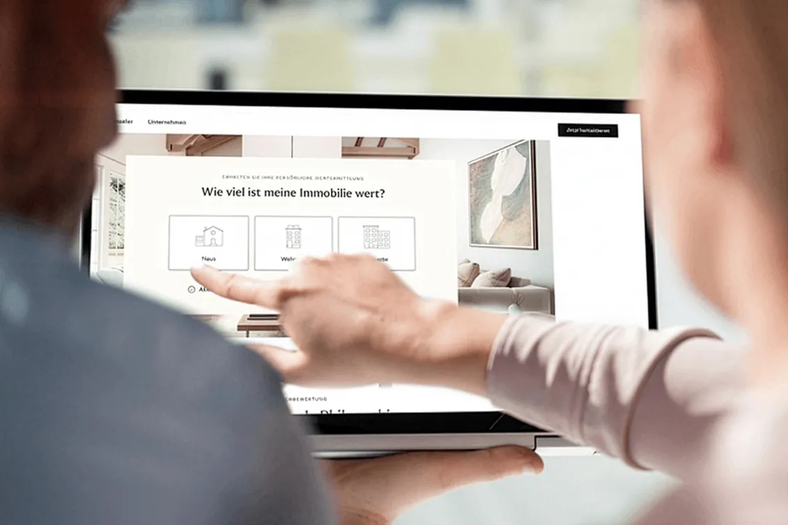 People look at an online property valuation together to estimate the market value.