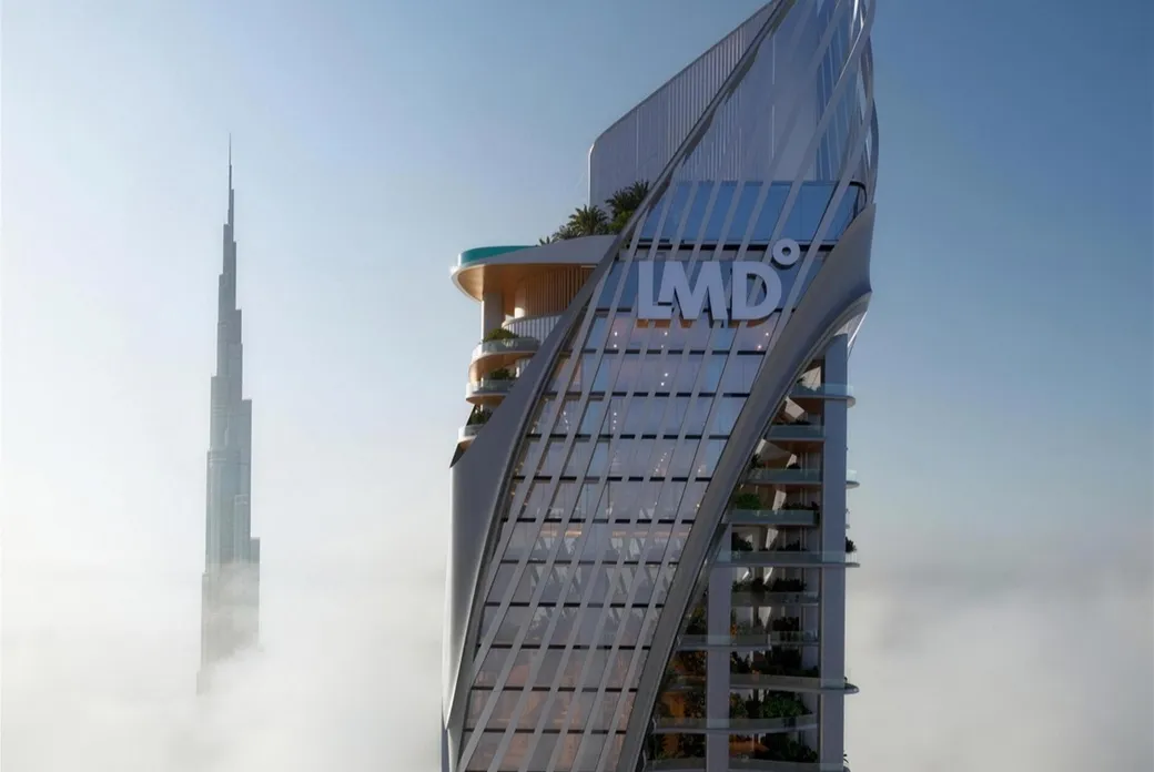 Futuristic glass skyscraper with curved design and 'LMD' logo, balconies with greenery, rising above clouds; Burj Khalifa in the distance. AI-generated image