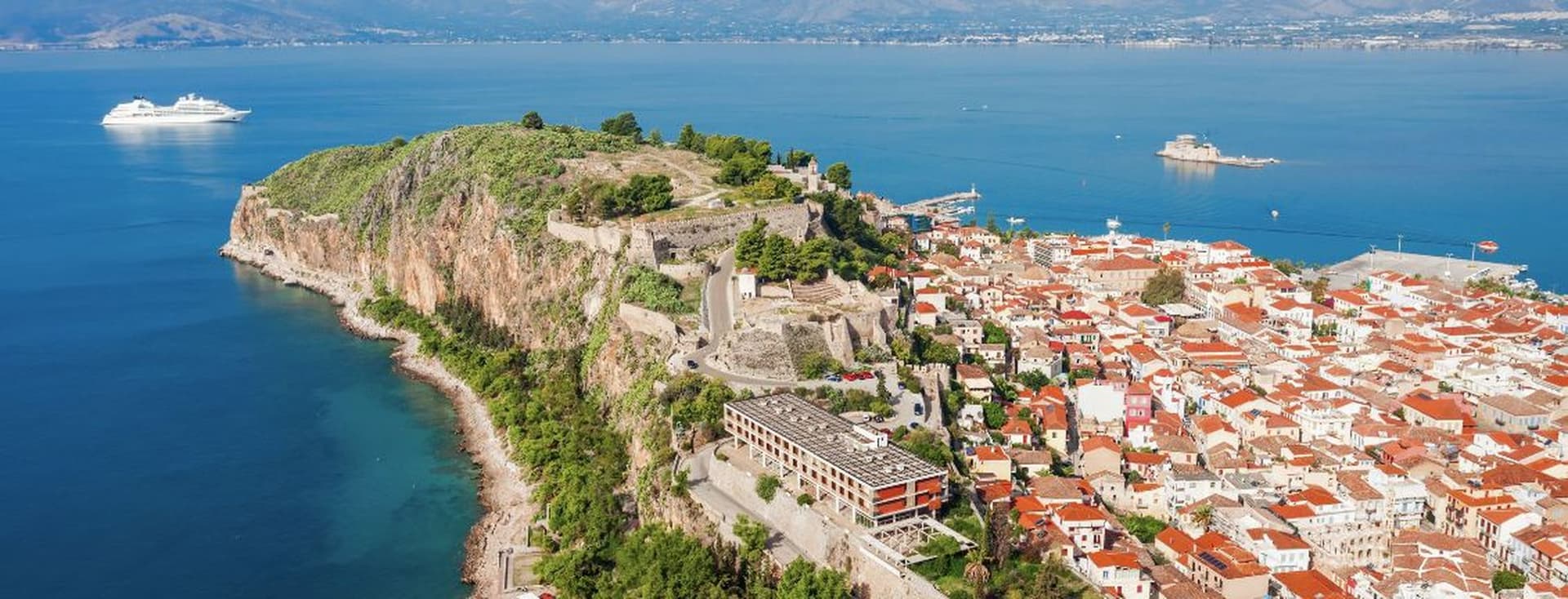 Aerial view of Nafplio with historic fortress, coastal town, and panoramic sea views