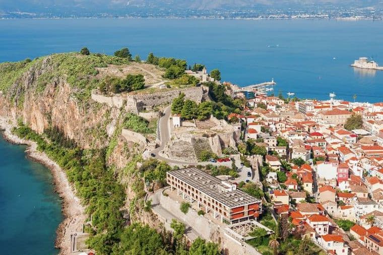 Aerial view of Nafplio with historic fortress, coastal town, and panoramic sea views