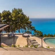 Luxury seaside villa with infinity pool, panoramic sea views, and lush natural surroundings