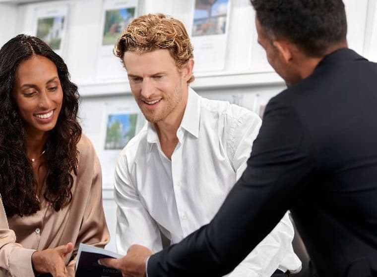 Couple receives consultation for buy-to-let mortgage from mortgage advisor