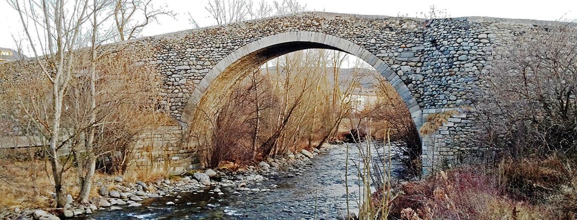 Romanesque bridge over a river in Sant Martí de Aravó.