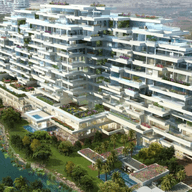 Aerial view of Al Barari surrounded by lush greenery and a lake, with a sprawling landscape in the background.