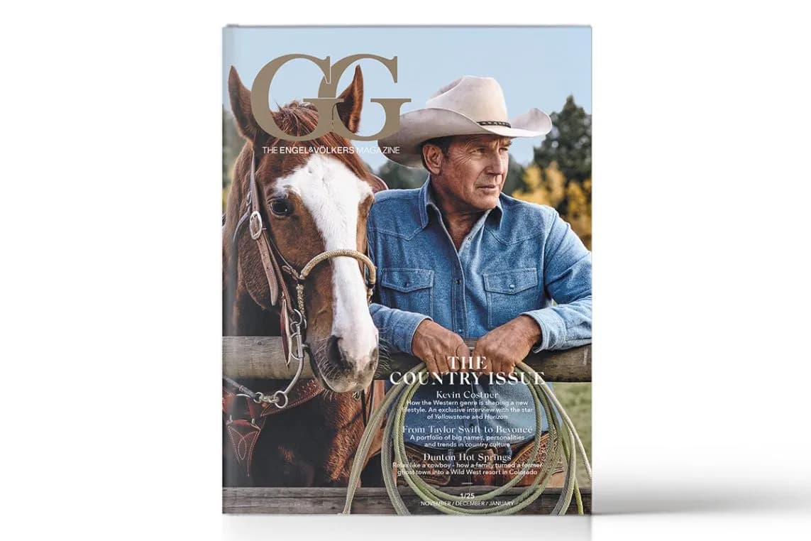 Front cover of a magazine featuring a cowboy in a denim shirt and hat with a horse and coiled rope.