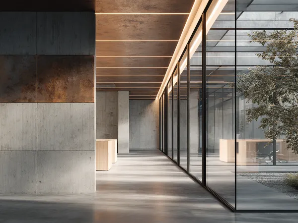 Minimal modern office corridor with concrete walls, wooden ceiling and linear LED lights, glass wall revealing courtyard with tree and desks. AI-generated image