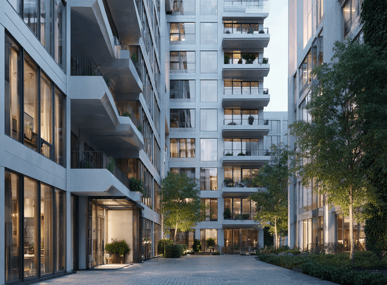 Modern apartment complex with large glass windows, balconies, and greenery. Courtyard area with paved paths and ambient evening lighting.